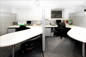 Modern office cubicles divided with folding screens
